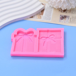Pink silicone gift box mold for chocolate, cake, and soap making with bow details