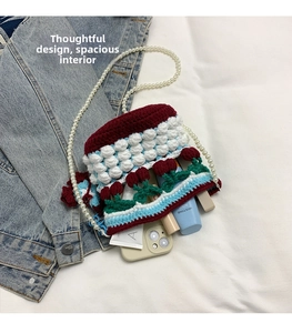 Detail view of the spacious knit bucket bag interior with phone and lipstick storage