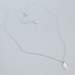 Detail of 925 sterling silver conch pendant necklace with heart tag and extension chain