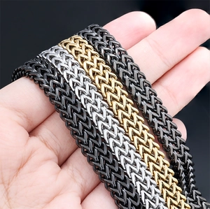 Close-up of men's stainless steel Franco chains in black, silver, and gold finishes