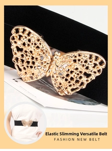 Close-up of golden butterfly buckle on black elastic waist belt for dresses