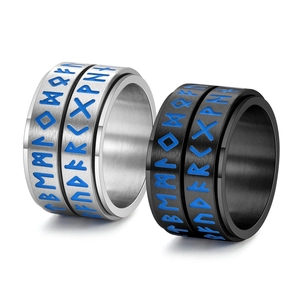Close-up of Viking Rune spinner ring in silver and black with blue engraved details