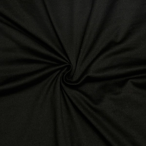 Macro shot of black fabric texture showing soft luster and elegant spiral drape of the dress