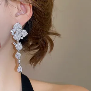 Elegant silver tassel earrings with sparkling zircon petals and pear-shaped drop pendants