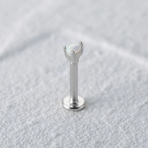 Macro shot of S925 sterling silver pear-shaped opal cartilage stud with threaded flat back