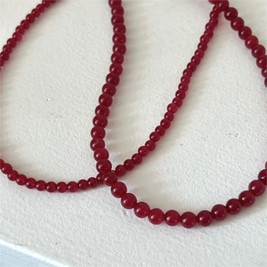 Macro detail of red carnelian agate beaded necklace with polished 925 silver clasp