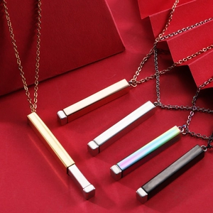 Detailed view of polished stainless steel bar necklaces in five assorted metallic finishes