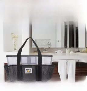 Mesh tote bag detail featuring multiple storage compartments and breathable mesh texture