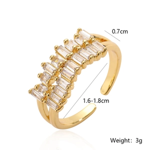 Detail of 18K gold plated ring showing 0.7cm width and zircon crystal settings