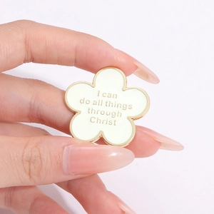White flower enamel brooch with gold trim and I Can Do All Things religious lettering