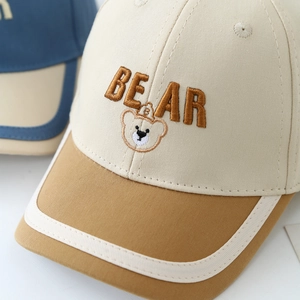 Two-tone cotton bear baseball cap for kids with brown embroidery on a cream crown