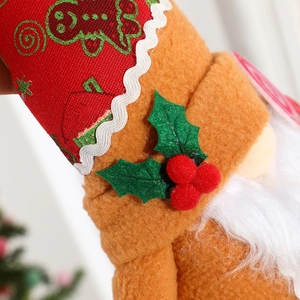 Macro detail of Christmas gnome plush featuring festive felt textures and embroidery