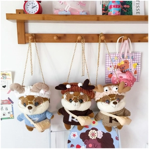 Detailed view of Shiba Inu plush bags featuring glasses, sweaters and metal chain straps