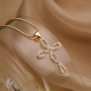 Chic gold-plated cross pendant necklace with infinity symbol and pave cubic zirconia stones