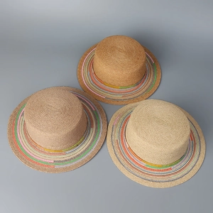 Three raffia straw boater hats with colorful rainbow stitching on flat brims
