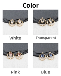Detail of twisted 18k gold pendants with marquise-cut gems in four assorted colors