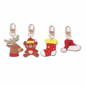 Christmas keychain set with cute reindeer, bear, sock and hat charms in gold finish