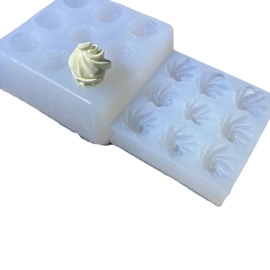 Light blue silicone fondant mold with nine swirl ice cream cone patterns and sample