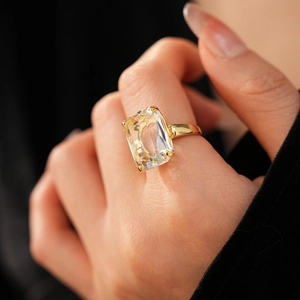 Macro shot of 14k gold plated ring featuring a large emerald cut champagne zircon stone