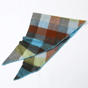 Close-up of multicolor checkered cashmere feel scarf with detailed blue edge stitching