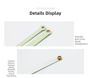 Detailed view of luminous clock hands with smooth metal finish and brass bushings