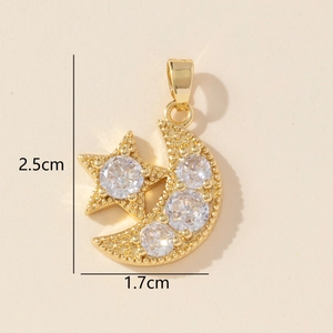 Detailed view of gold star moon pendant with cubic zirconia inlay measuring 2.5cm by 1.7cm