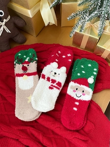 Three pairs of thick coral fleece Christmas socks featuring elk, polar bear and Santa motifs
