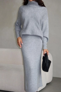 Detailed knit texture of grey turtleneck sweater and matching bodycon skirt two-piece set