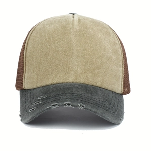 Close-up of distressed brim and breathable mesh texture on the vintage trucker hat