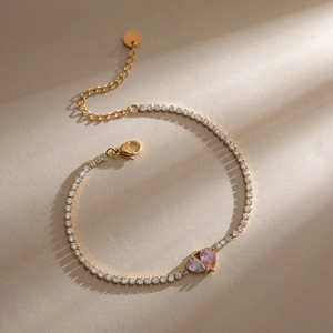 Luxury 18K gold-plated tennis bracelet featuring double heart-shaped cubic zirconia stones