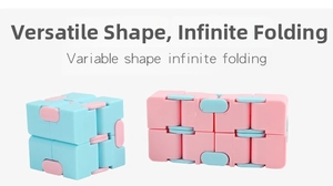 Macro view of macaron pink and blue infinity cubes showing infinite folding structure
