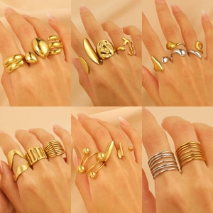 Close-up of modern 18K gold plated stainless steel geometric rings worn by a model