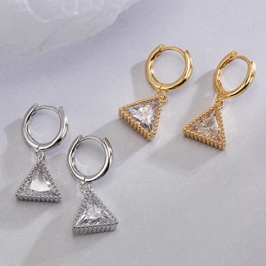 Minimalist gold and silver hoop earrings with sparkling triangle zircon pendants