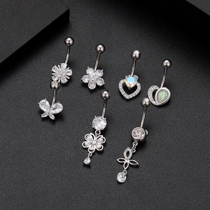 Selection of zircon and opal belly button rings in various stylish silver designs