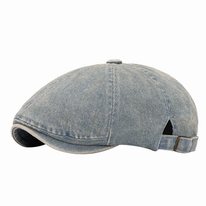 Retro light blue washed denim newsboy cap with vintage texture and adjustable metal buckle