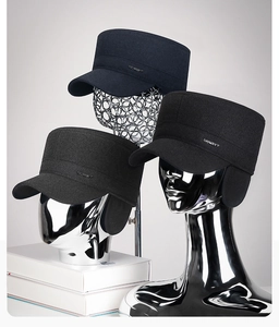 Detailed view of winter wool flat caps with earflaps and sport logo in three colors