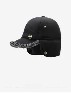 Detail of wool baseball cap featuring ear flaps and metallic ny logo emblem