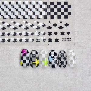 Japanese checkerboard nail art stickers featuring black white hearts and star patterns