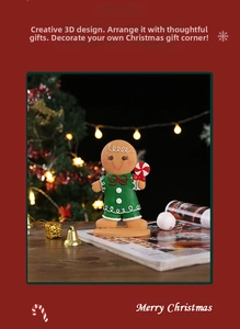 Festive Christmas gingerbread man resin ornament with candy cane on a wooden table