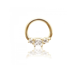Detailed view of a gold seamless nose ring set with three sparkling square and round stones