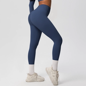 Close-up of high-waisted yoga leggings showing double-sided brushed fabric and lifting effect