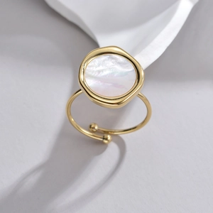 Minimalist 18K gold titanium ring with irregular round mother of pearl inlay and open band
