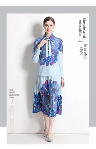 Detail of the blue floral print shirt with bow tie collar and pleated skirt set