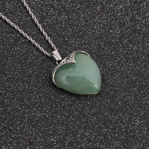 Fashion heart green aventurine stone pendant necklace with silver twisted chain on black background