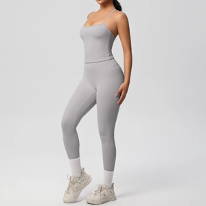 Detail of light gray yoga set featuring high-waisted leggings and slim-fit camisole top