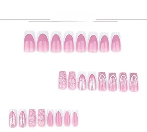 Detail of silver glitter gradient nails with heart patterns and French tip designs
