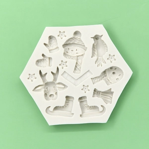 Hexagon silicone mold with Christmas deer, snowman, and snowflake shapes for baking and DIY