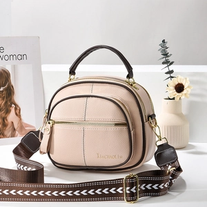 Minimalist multi-layer crossbody bag in beige lychee leather with woven shoulder strap