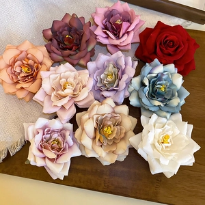 Elegant rose fabric hair clip collection in various colors for vacation styling