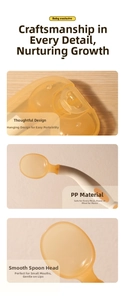 Macro detail of ergonomic PPSU baby feeding spoon showing smooth head and storage case hook